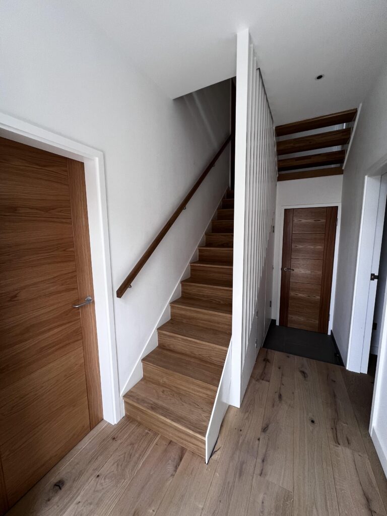 New timber staircase and hallway after structural renovation in Putney