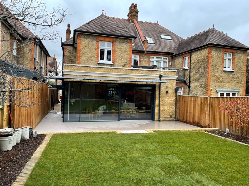 Single-storey rear extension with slim sliding doors in Putney