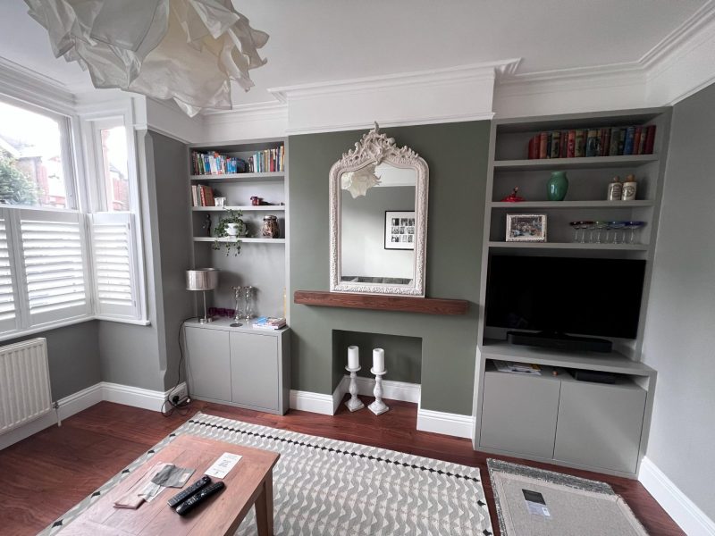 Alcove cupboards and shelving either side of a chimney breast