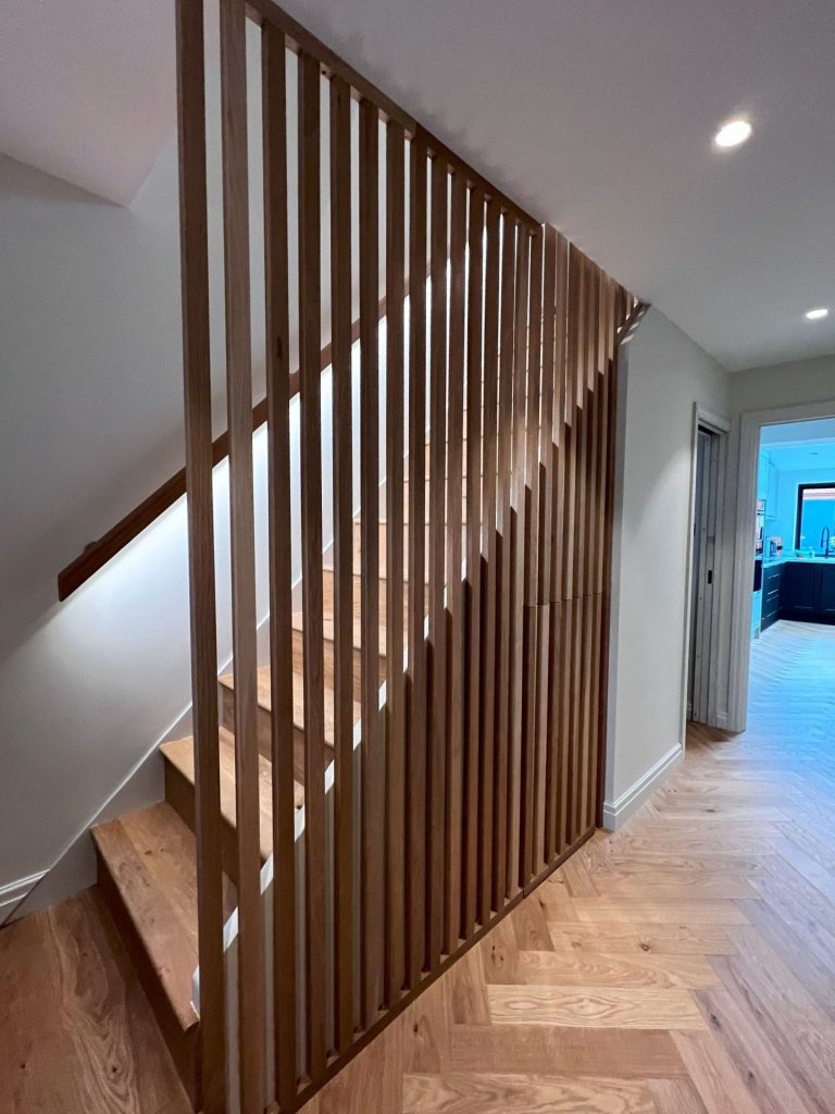 Timber staircase with slatted balustrade screen