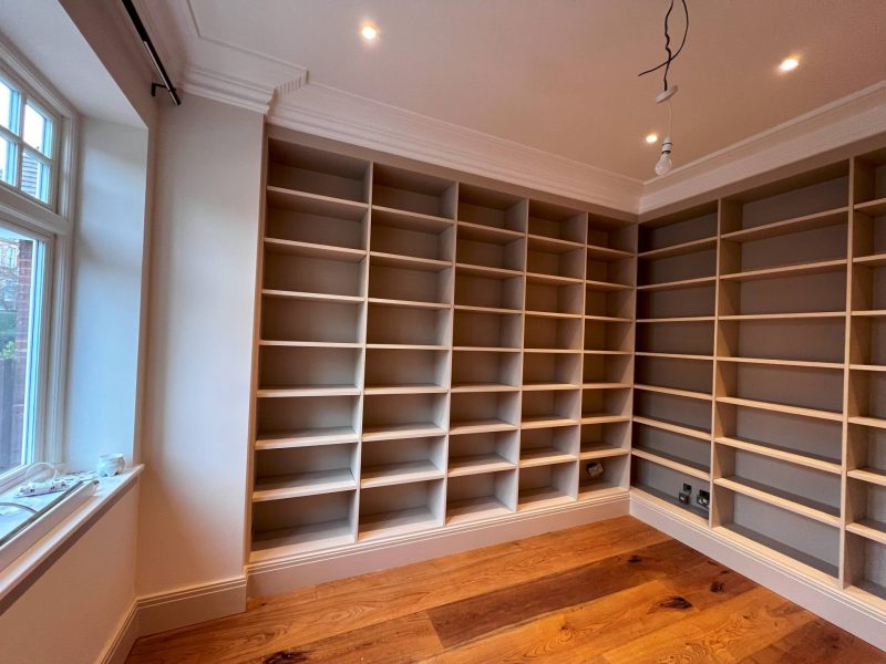 Floor-to-ceiling library shelving in oak