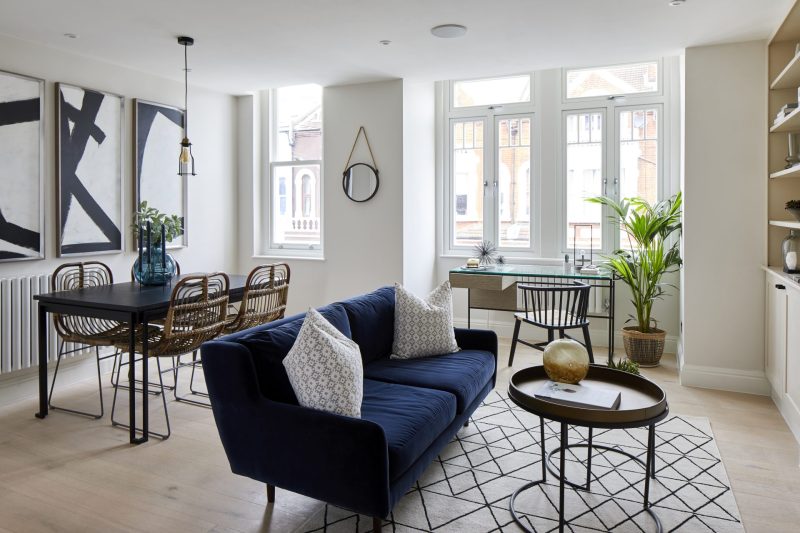 Renovated living and dining room with built-in shelving