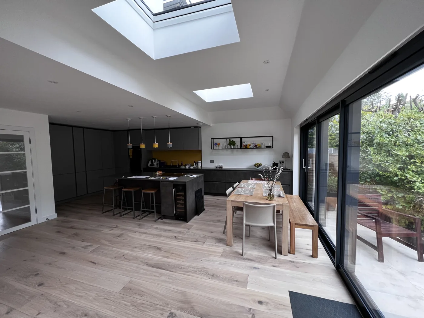 Open-plan kitchen and dining room lit by rooflights, Barnfield Avenue, Kingston