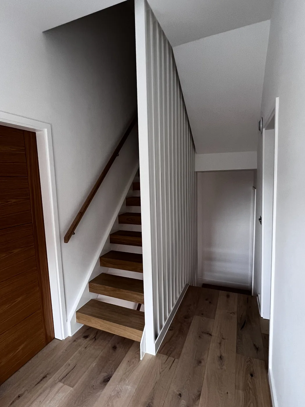 New staircase with oak treads, handrail and slatted screen