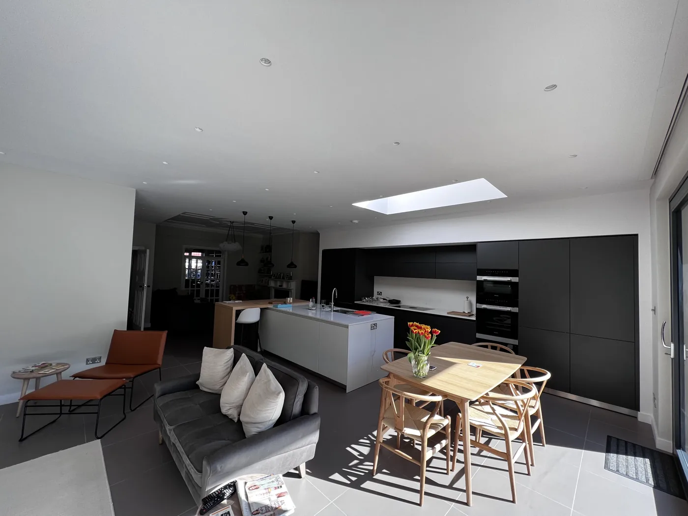 Kitchen and dining space under a flat rooflight, Montolieu Gardens, Putney