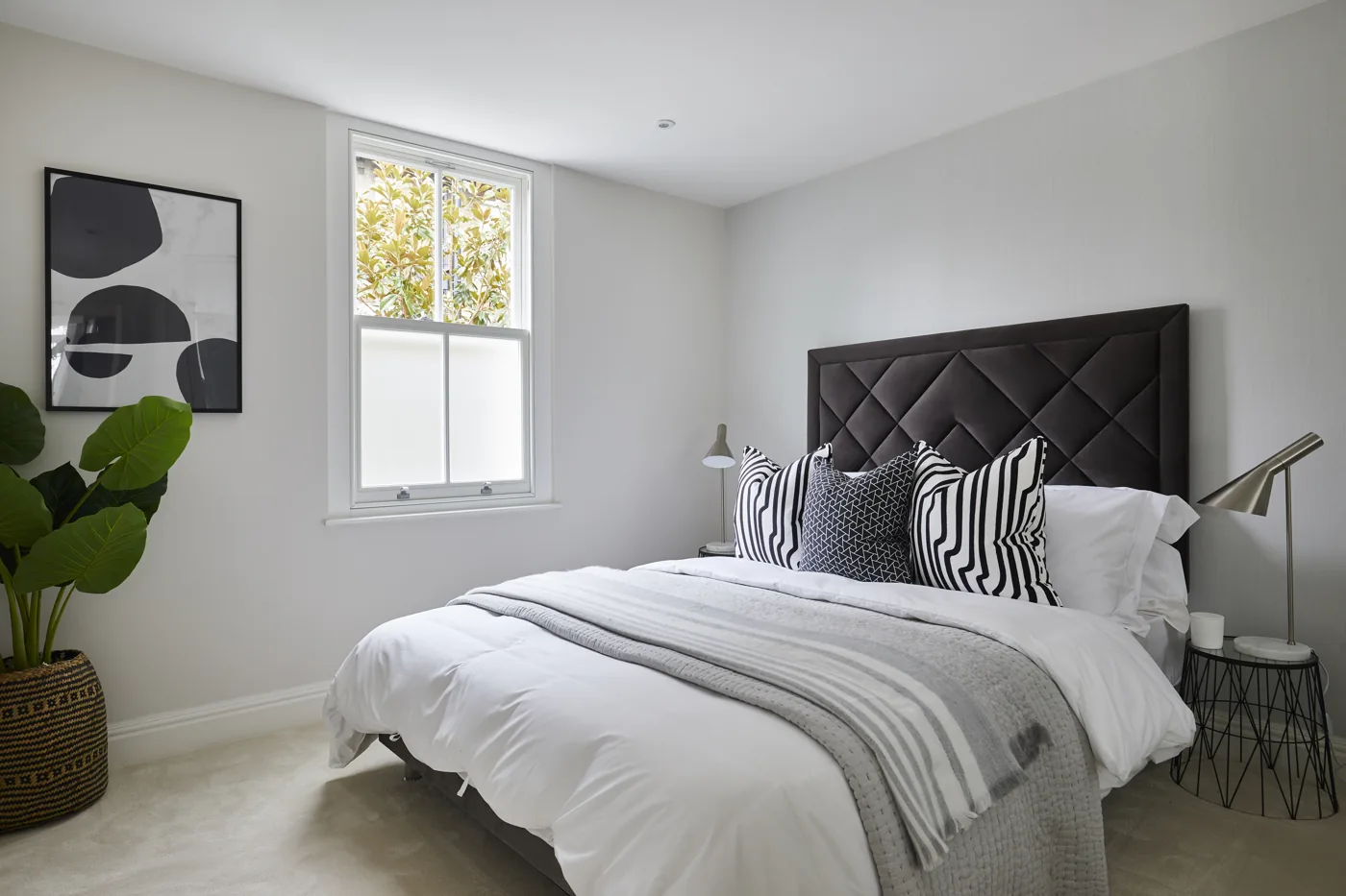 Renovated bedroom with a white timber window, Mysore Road, Clapham