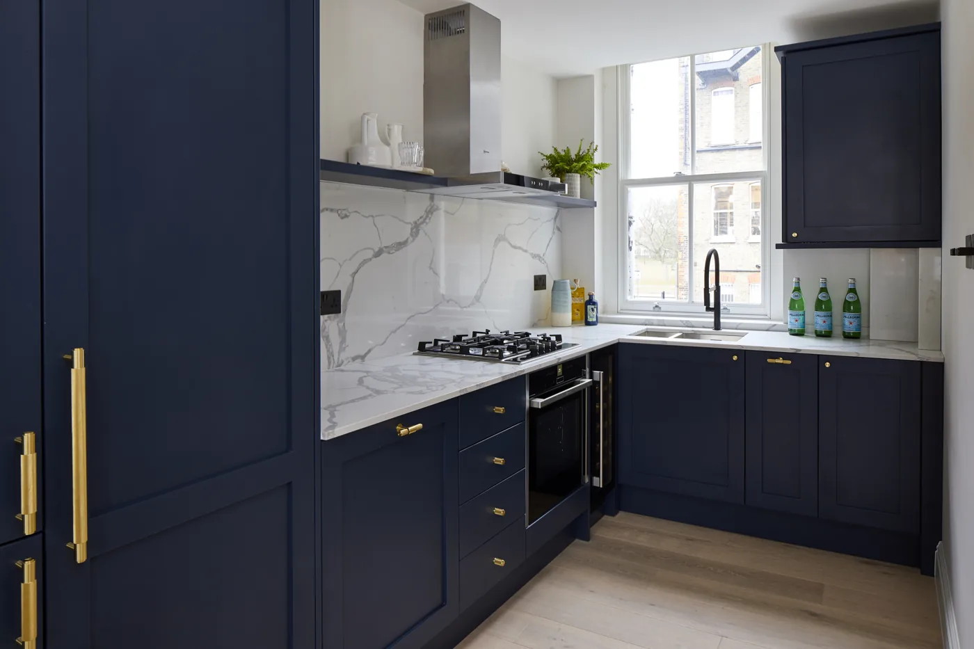 Navy shaker kitchen with a marble-effect splashback, Mysore Road, Clapham