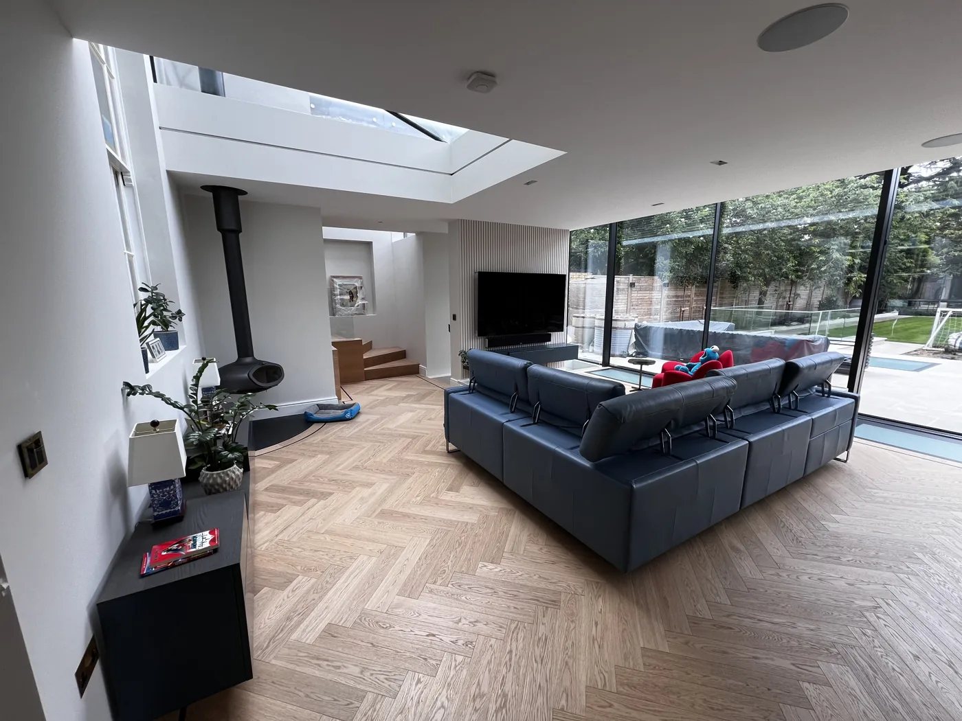 Open-plan living space with rooflights, herringbone floor and glazing to the garden, Upper Richmond Road, Putney