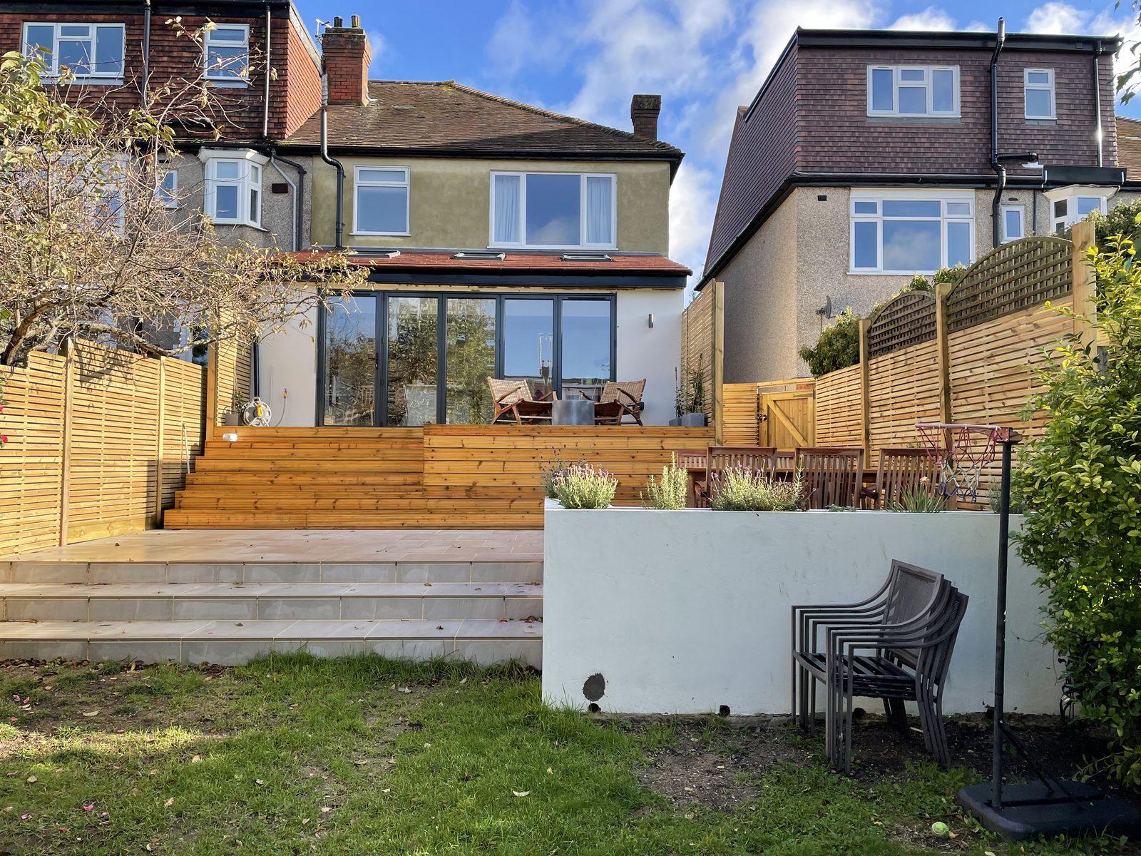 Rear elevation with broad glazed openings connecting the house to the garden on Park Way, Wimbledon